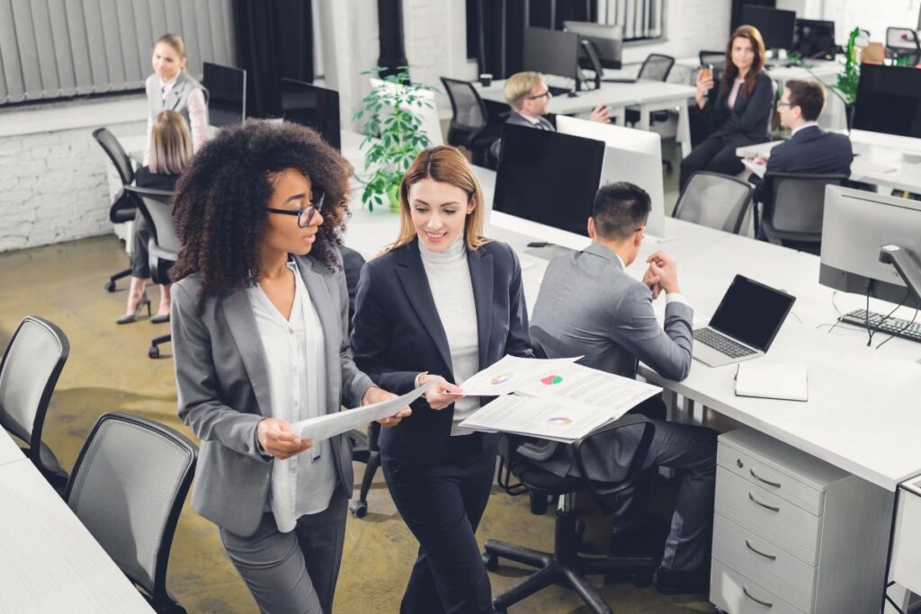 Employees improving productivity through collaborative workplace leadership