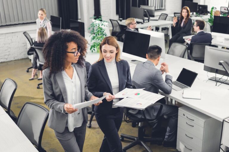 Employees improving productivity through collaborative workplace leadership